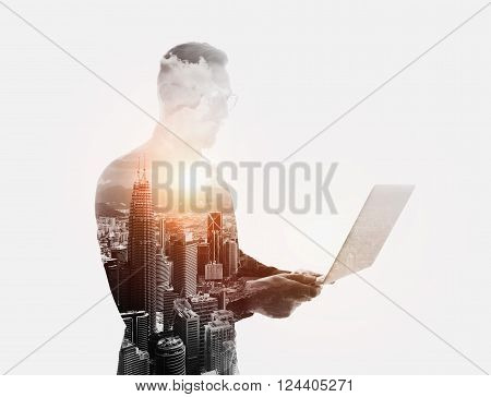 Double exposure bearded businessman wearing black shirt and glasses.Banker holding contemporary notebook hands.Work online banking.Isolated white, modern city sunset background.
