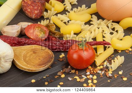 Ingredients for preparing pasta. Cooking pasta dishes. A traditional dish of pasta. Healthy diet meals.