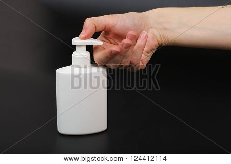 Liquid Soap Dispenser And A Human Hand