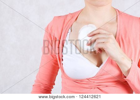 Breastfeeding Mother Keeps Nursing Pad.