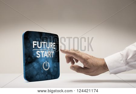 Finger about to press modern screen with the text future start beige background. Concept image for illustration of innovation or strategic vision.