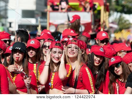 LIMASSOL CYPRUS - MARCH 13 :Group of Happy teenage girls dressed in red costumes at famous Limassol Carnival Parade on March 13 2016 in Limassol town Cyprus.