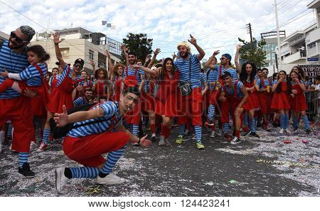 LIMASSOL CYPRUS - MARCH 13: Happy people in teams dressed with colorfull costumes at famous Limassol Carnival Parade on March 13 2016 in Limassol town Cyprus.