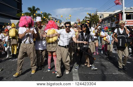 LIMASSOL CYPRUS - MARCH 13 : Happy people in teams dressed with colorfull costumes at famous Limassol Carnival Parade on March 13 2016 in Limassol town Cyprus.