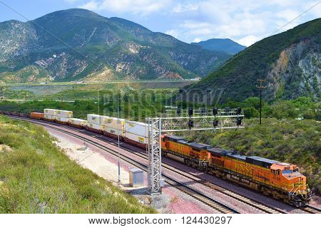 March 29, 2016 in Cajon, CA:  BNSF Freight Train transporting commerce traveling southbound towards Los Angeles taken in Cajon, CA