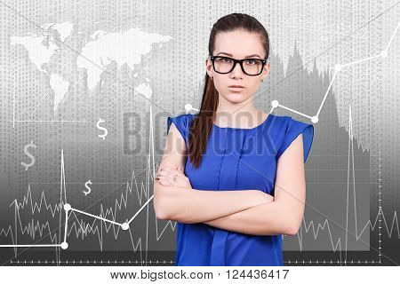 Young woman standing on the traiding graph background. Elements of this image furnished by NASA
