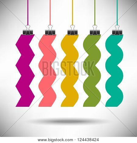 A continuum of zigzag to wavy shapes in rainbow colors suspended by clips