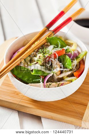 Delicious asian rice glass noodles with vegetables and chicken (wok)