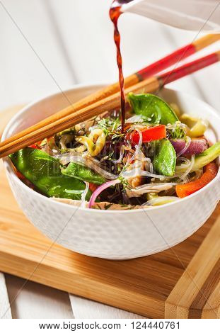 Delicious asian rice glass noodles with vegetables and chicken (wok)