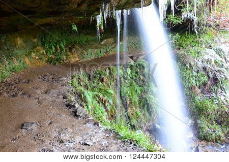 A view from under the overhang from which Maspie den waterfall drops into the chasm below