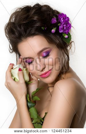 Portrait Of Young Beautiful Female Holding White Rose With Violet Cloves In Her Hair