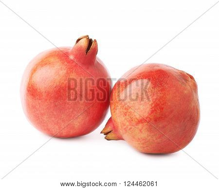 Two pomegranate punica granatum fruits composition isolated over the white background