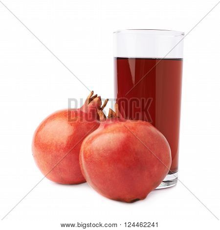 Pomegranate Punica granatum fruit next to the tall glass full of red juice, composition isolated over the white background