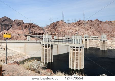 View of the penstock towers over Lake Mead at Hoover Dam, between Arizona and Nevada states, USA.