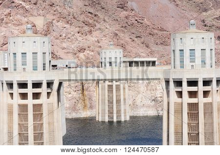View of the penstock towers over Lake Mead at Hoover Dam, between Arizona and Nevada states, USA.