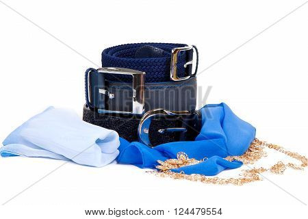 Three leather belt and a blue scarf on a white background