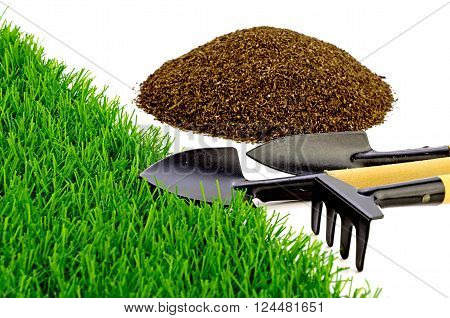 Small Gardening Tools and Artificial Turf Isolated on White Background.