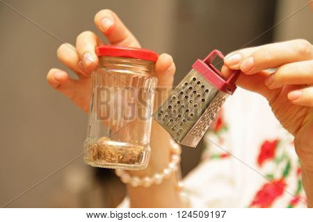 Small gater for cheese in the hands of women
** Note: Visible grain at 100%, best at smaller sizes