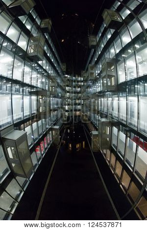 Beautiful illuminated windows with relfection in glass - modern building, fisheye