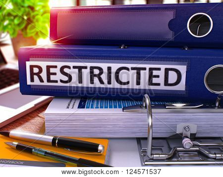 Blue Office Folder with Inscription Restricted on Office Desktop with Office Supplies and Modern Laptop. Restricted Business Concept on Blurred Background. Restricted - Toned Image. 3D.