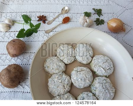 Potato goutweed cutlets cooking food for a vegetarian diet with onion, garlic and spices