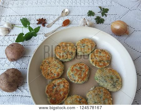Potato goutweed cutlets cooking food for a vegetarian diet with onion, garlic and spices