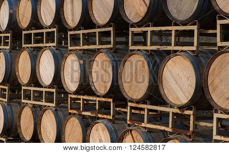 Rown Of Wine Barrels On A A Stand