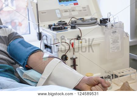 The process of sampling from the donor plasma. the instrument returns back to blood components, taking only the plasma
