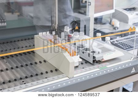Plasma samples are in the sterile box. Laboratory table for the study of blood samples