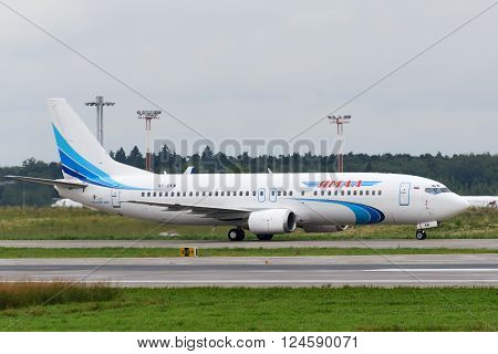 DOMODEDOVO RUSSIA - JULY 20: Aircraft operated by JSC Yamal Airlines ready to take off at Moscow airport in Domodedovo on July 20 2013. The company in its fleet has 9 aircraft Boeing-737