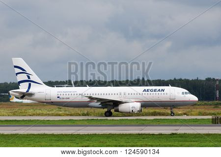 DOMODEDOVO RUSSIA - JULY 20: Aircraft operated by Aegean Airlines ready to take off at Moscow airport in Domodedovo on July 20 2013. The company in its fleet has 25 aircraft Airbus-A320