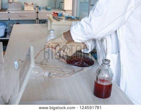 The process of monitoring the quality of the blood. Instrumental laboratory manipulations