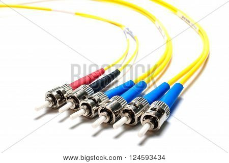 Three double-single-mode optical connectors ST-type. Isolated on white background.