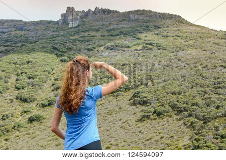Girl On A Mountain Looking At The Distance