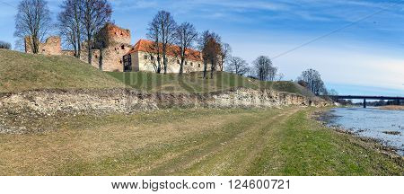 Old medieval castle near river in Bauska town, Latvia