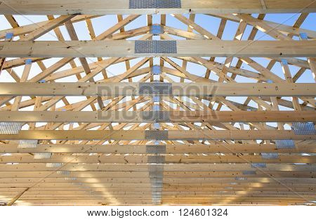 wooden framework in process of roof constraction