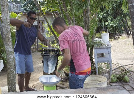 Manaca Iznaga Cuba - January 2 2016: Valle de Los Ingenios sugar cane juice preparation by two cuban guys