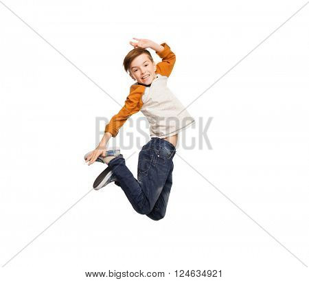 happiness, childhood, freedom, movement and people concept - happy smiling boy jumping in air