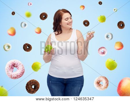 healthy eating, junk food, diet and choice people concept - smiling plus size woman choosing between apple and donut over blue background