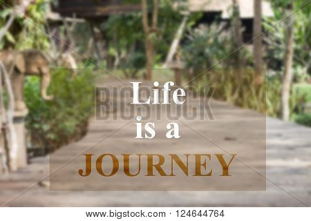 Life is a journey insparational quote on garden background