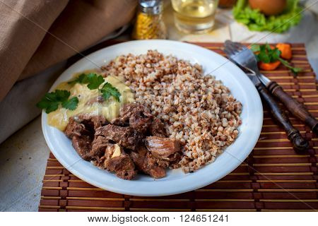 Hot gulyash, roast meat, in white souce
