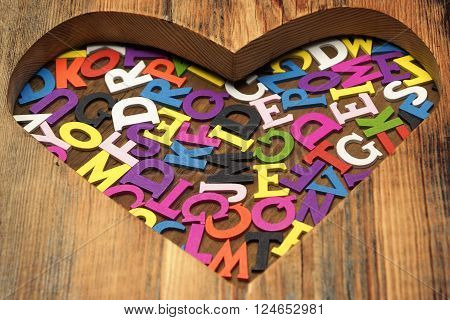 Many Different Color English Letters Or Alphabet In Heart Shape Made Of Wood Copy Space Background Close Up