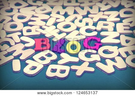 Blog Colored Sign Among Different Uncolored Letters On Green Background Top View Close Up
** Note: Shallow depth of field