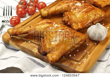 Three Grilled Bbq Chicken Leg Quarter On Wood Board