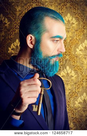 Vintage portrait of a handsome man with blue beard. 