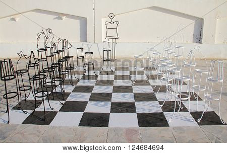 Outdoor big chess board with melal pieces