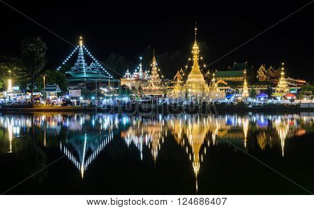 Beautiful view of Burmese style temples with reflection on lake Wat Chong Klang and Wat Chong Kham in Mae Hong Son, Thailand