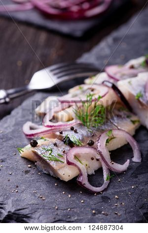Sliced Herring On A Black Slate Plate