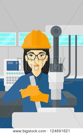 Woman working with industrial equipment.