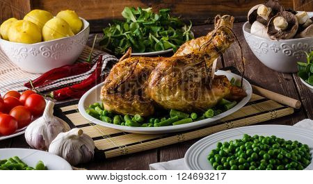 Feast - grilled chicken with potatoes vegetables and wine